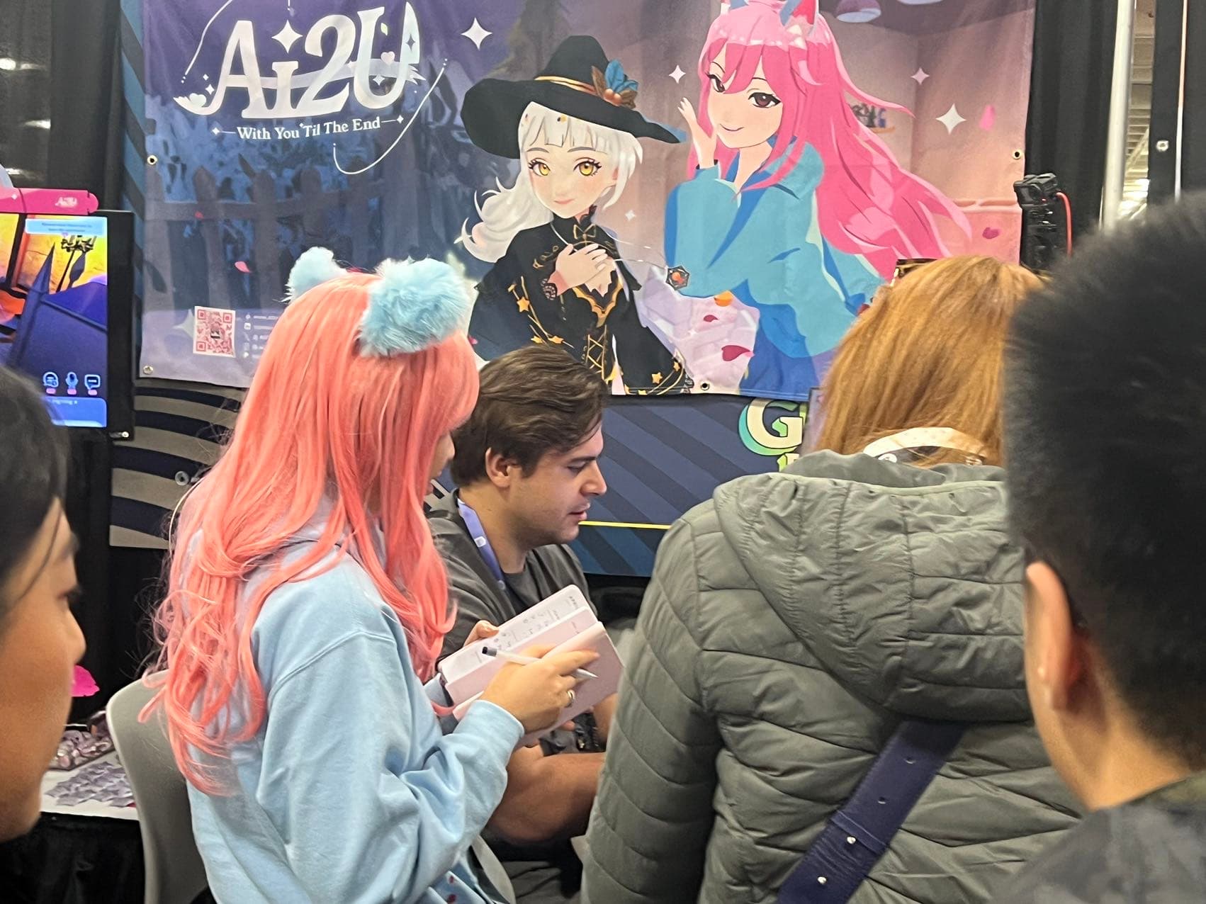 AI2U cosplay beside an active booth demo at GDC 2024