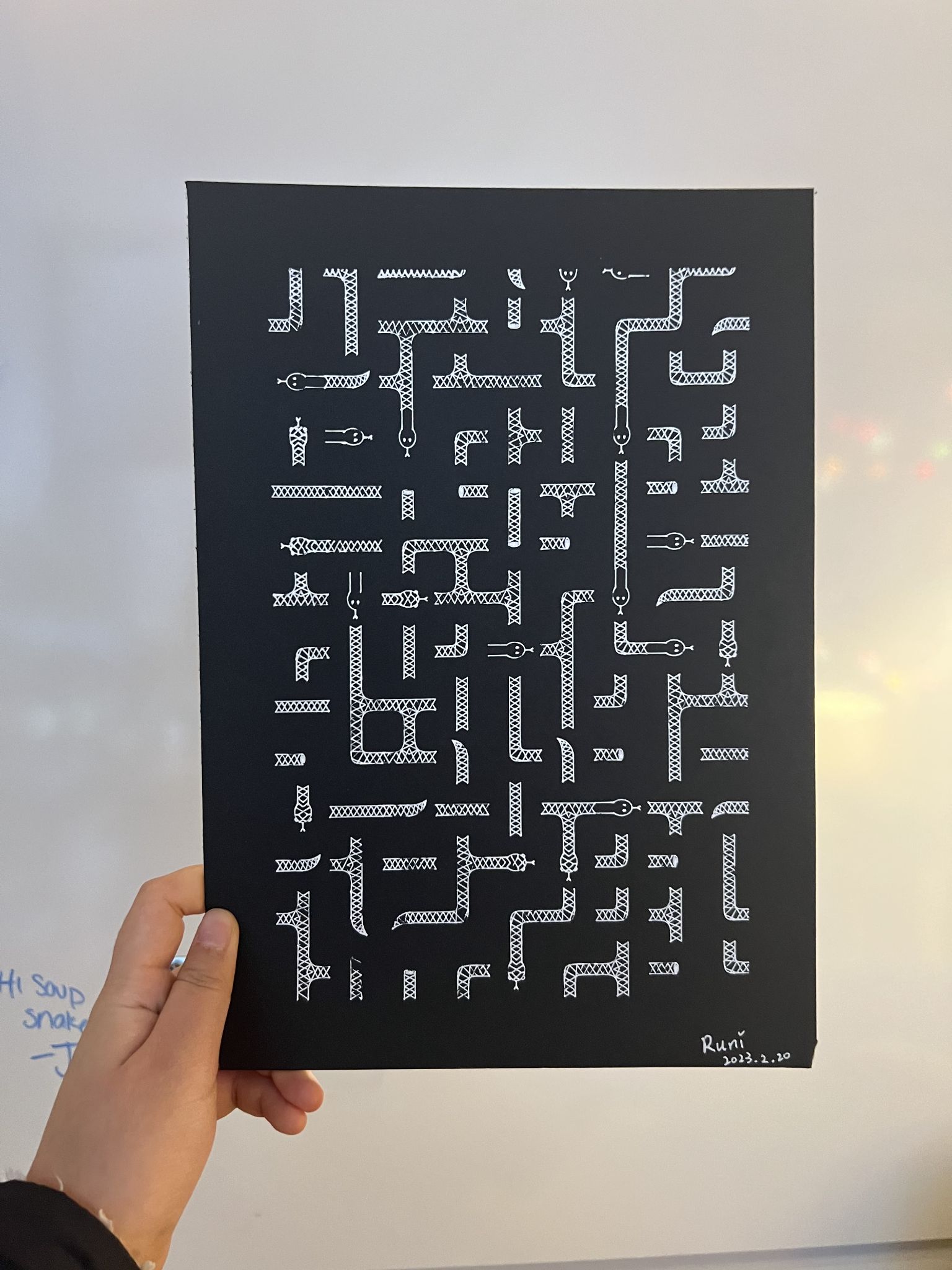 White geometric pen plotter drawing on a black card